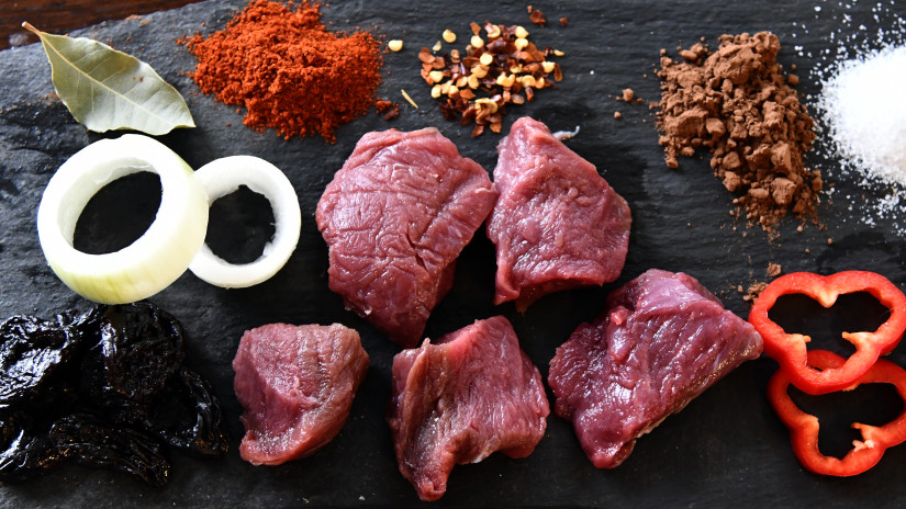 Moose meat and other ingredients on the table.